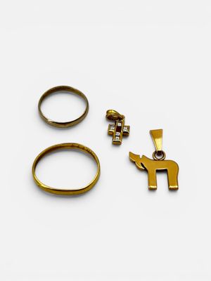 two gold rings and a ring with an elephant on it