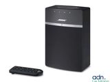 Système audio Bose avec télécommande, sur fond blanc