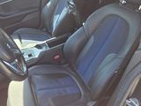 the interior of a car with black leather seats and blue trims