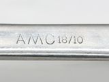 an image of a close up of a knife on a white surface