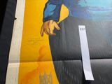 a poster of a sailor holding a gun in his right hand