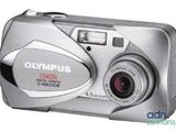 an image of a silver camera with a red lens on a white background
