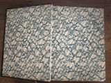 a blue and white book on a wooden table