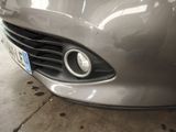 a close up of the front of a car with a number plate on it