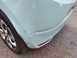 a close up of a car with a denting on it