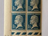 a close up of four stamps on a piece of paper