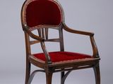 an image of a chair with a red upholstered seat on a white background