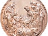 une image d'une médaille en bronze représentant une scène de la naissance de Jésus