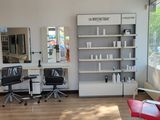 an image of a salon with a lot of chairs in it