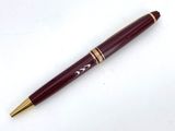 an image of a pen sitting on top of a white surface