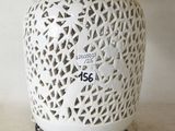 a white lamp that is sitting on a table