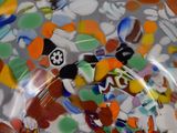 a close up of a glass plate with a lot of colorful glass beads