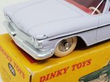 a toy car that is sitting on top of a box