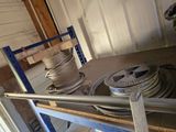 a lot of hoses that are sitting on a shelf