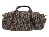 a brown and black duffel bag on a white background