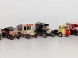 a lot of toy cars that are lined up on the wall