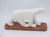 marble polar bear figurine on a marble base on a white background