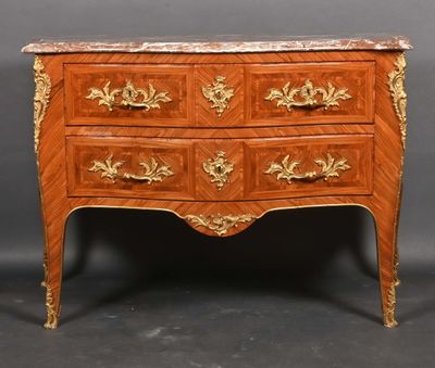 an antique chest of drawers with a marble top