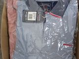packaging of a box containing a blue and white shirt and a pink and white shirt