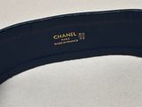 a close up of a black belt on a white surface