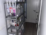 a metal shelving in the hallway of a house