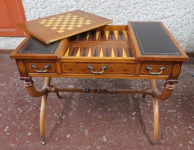 a wooden table with a chess board on top of it