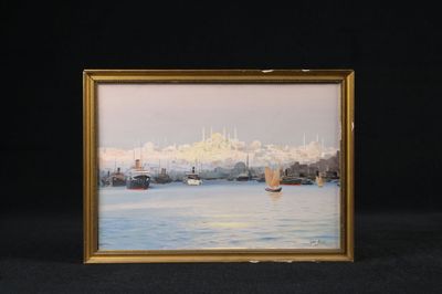 tableau encadré représentant une vue de ville avec des bateaux sur l'eau