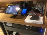 a computer desk with a monitor and a laptop on it