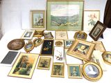 a lot of framed pictures and pictures on a table