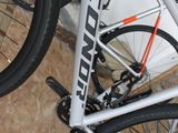 a close up of a bike parked on the floor