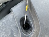 a small hole in the floor of a car