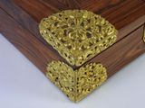 a wooden box with a gold heart on it