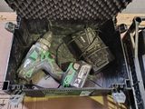 a green box with tools in it sitting on a table