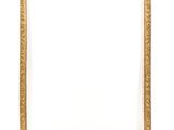 a gold picture frame on a white wall with a white background