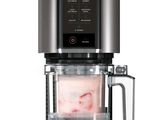 a coffee maker with a blender on top of it