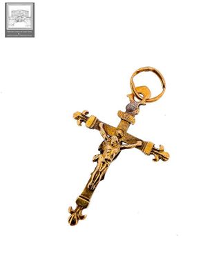 gold plated crucift with a cross on a white background