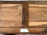 a wooden table with two doors open on it