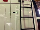 a ladder that is attached to the side of a van