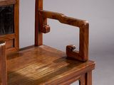 a wooden chair with a mirror on the back of it
