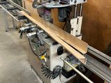 a picture of a machine that is working on a piece of wood