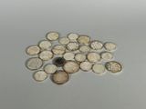 a pile of coins sitting on a table next to a coin