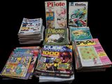 a lot of magazines that are sitting on a table