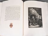 an open book with a picture of a group of people in front of it