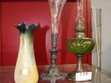 many glass vases on a glass shelf in a room