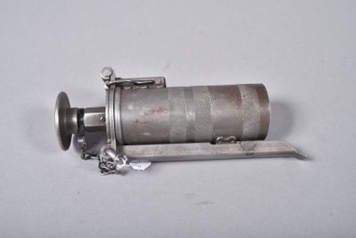 a small metal object with a chain around it