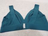 a close up of a bra top on a bed