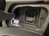 a car that has an electric charger attached to it