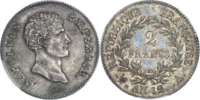 a silver coin with an image of a man on it