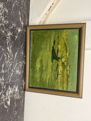 une photo d'un tableau accroché au mur