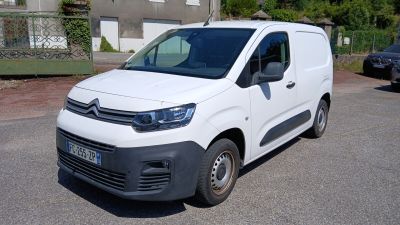 a white van that is parked in a parking lot